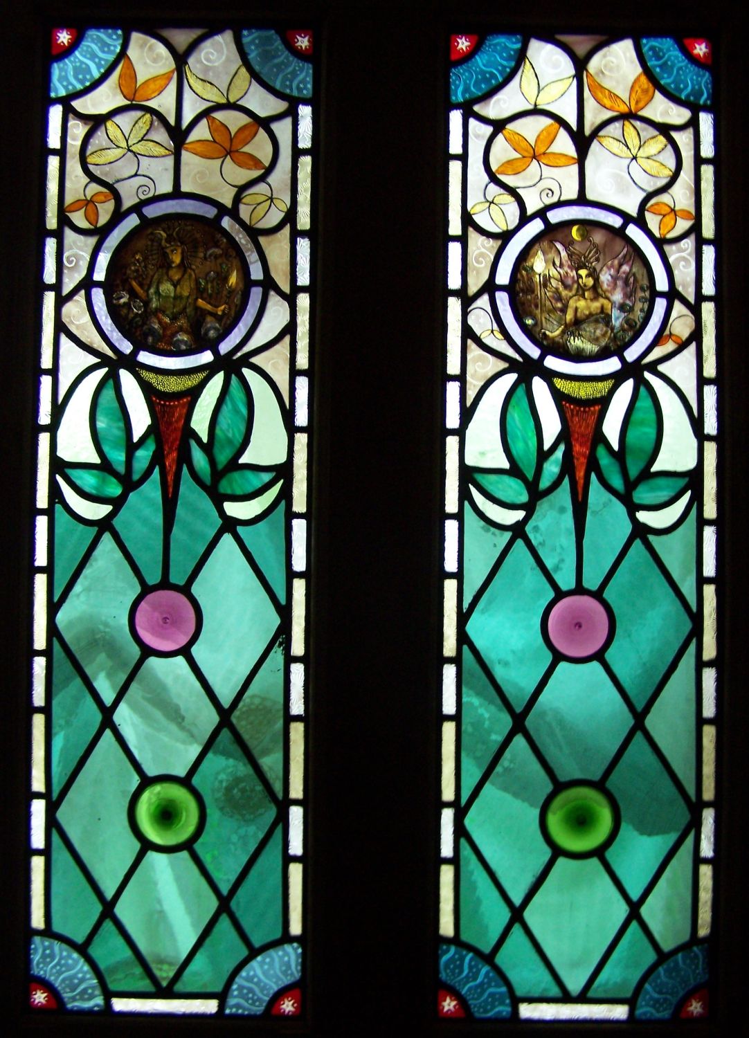 Victorian stained glass door with faery folk.